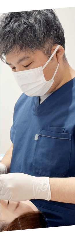 治療する歯科医